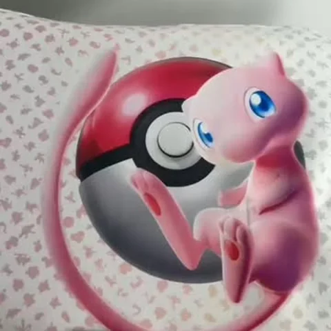 Mew and a Poké Ball, artwork on a card sleeve